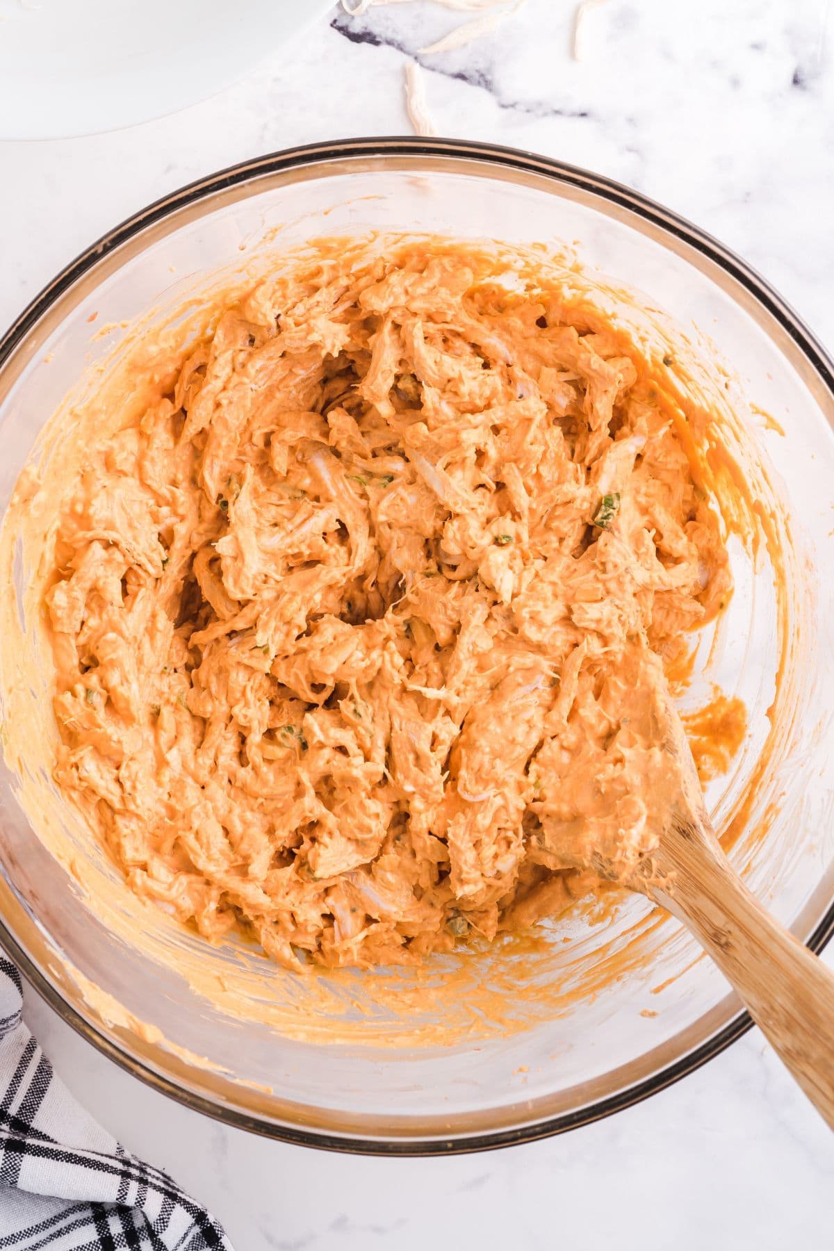 make the buffalo chicken pinwheels mixture in a bowl. 