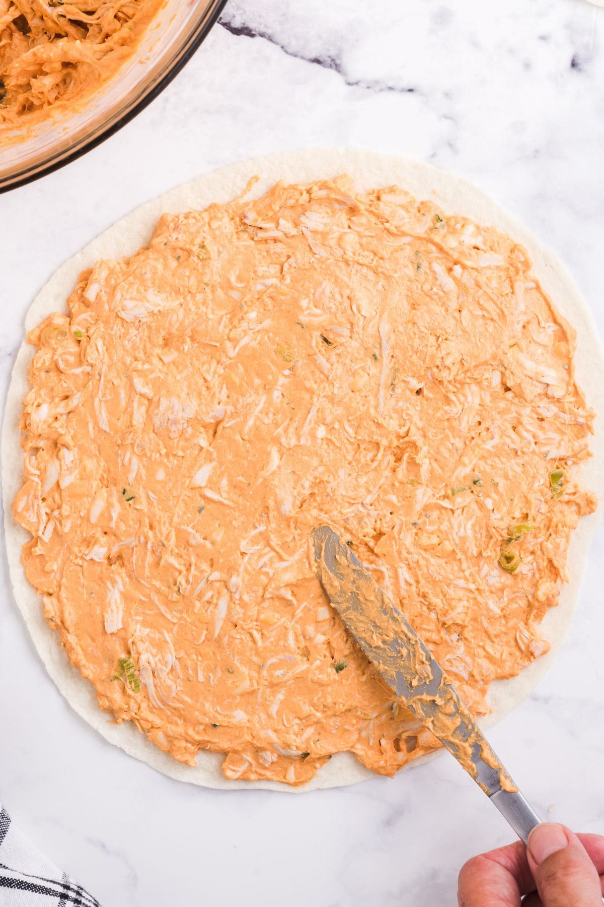 spread into tortilla. 