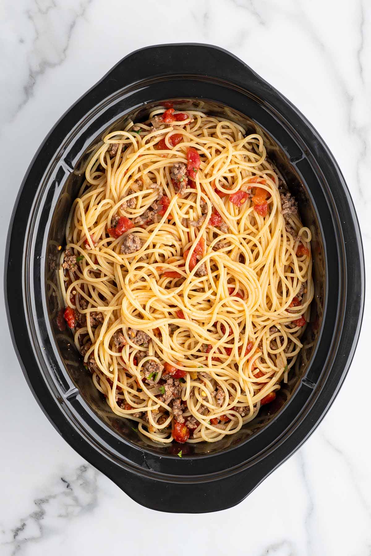 add spaghetti into the crockpot.