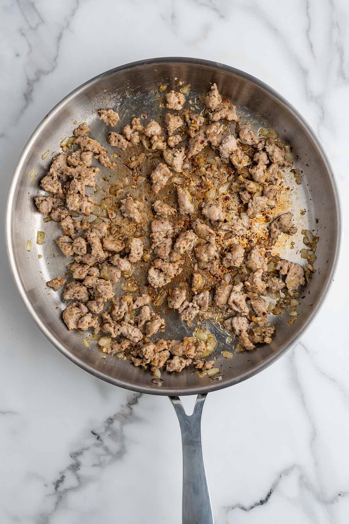 brown the sausage in a pan. 