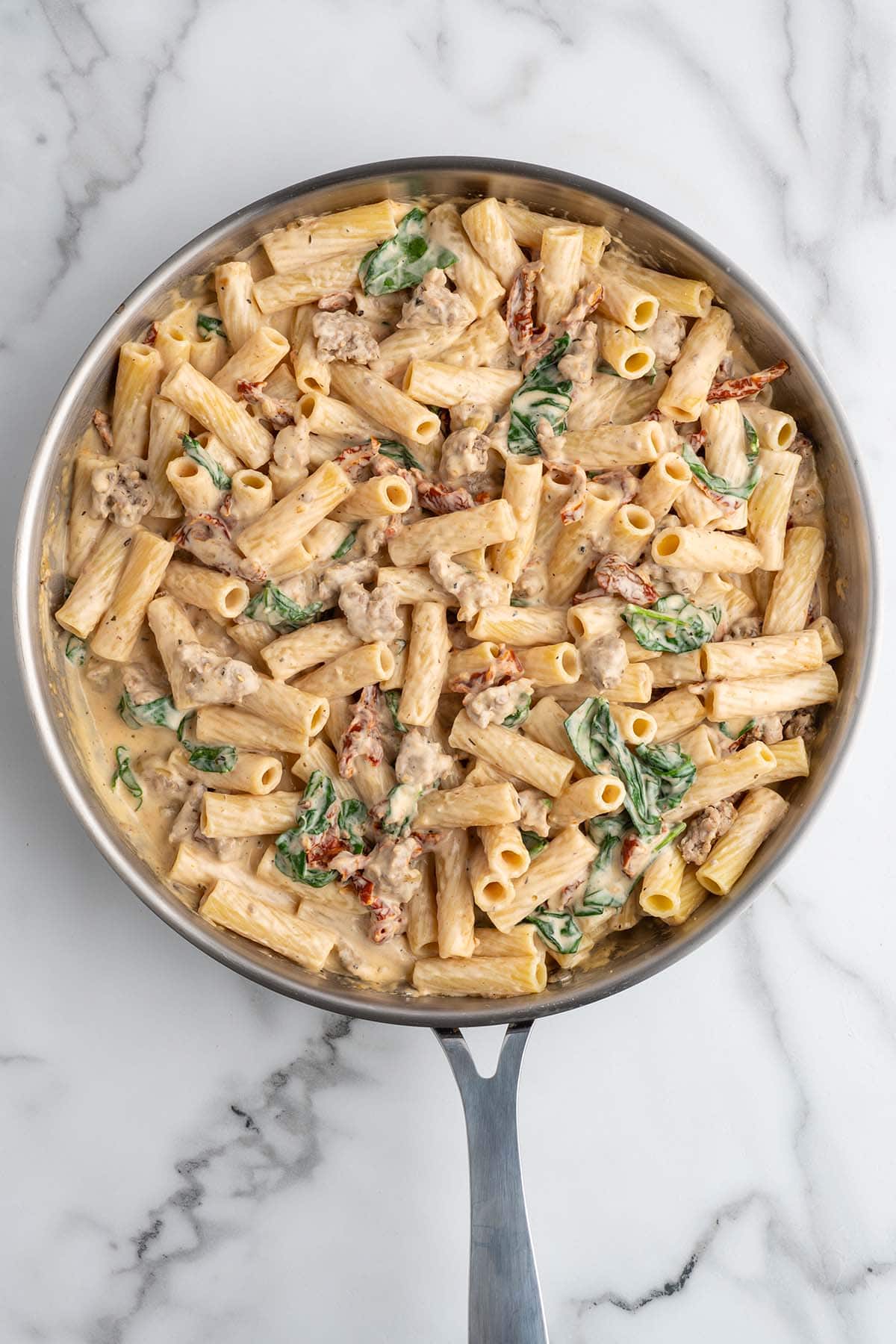 italian sausage pasta in a pan. 
