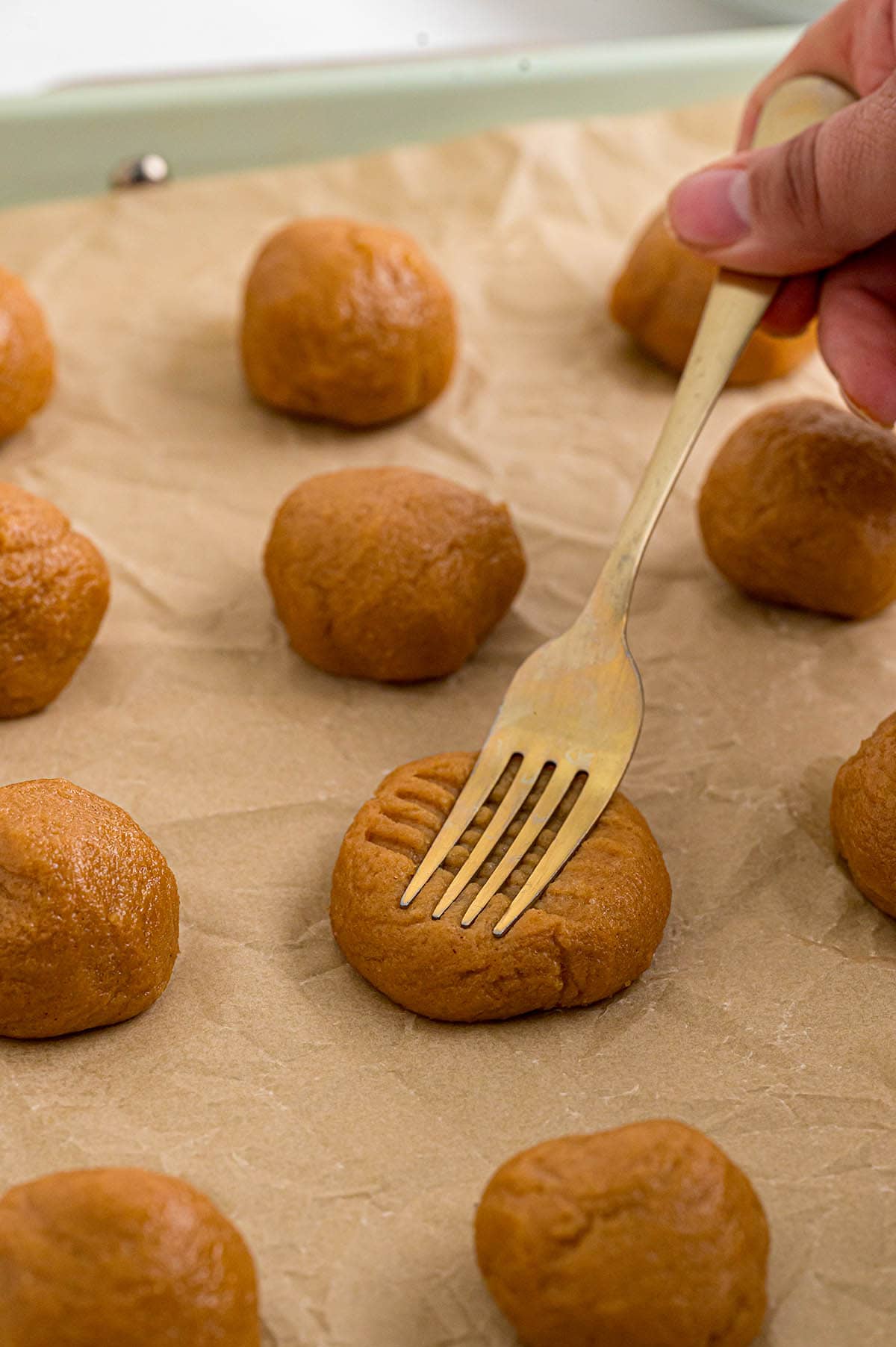 press the fork into the dough to make criss cross pattern.