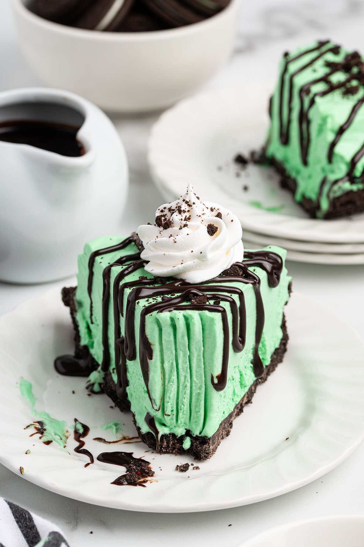 two plates of grasshopper pie on a table