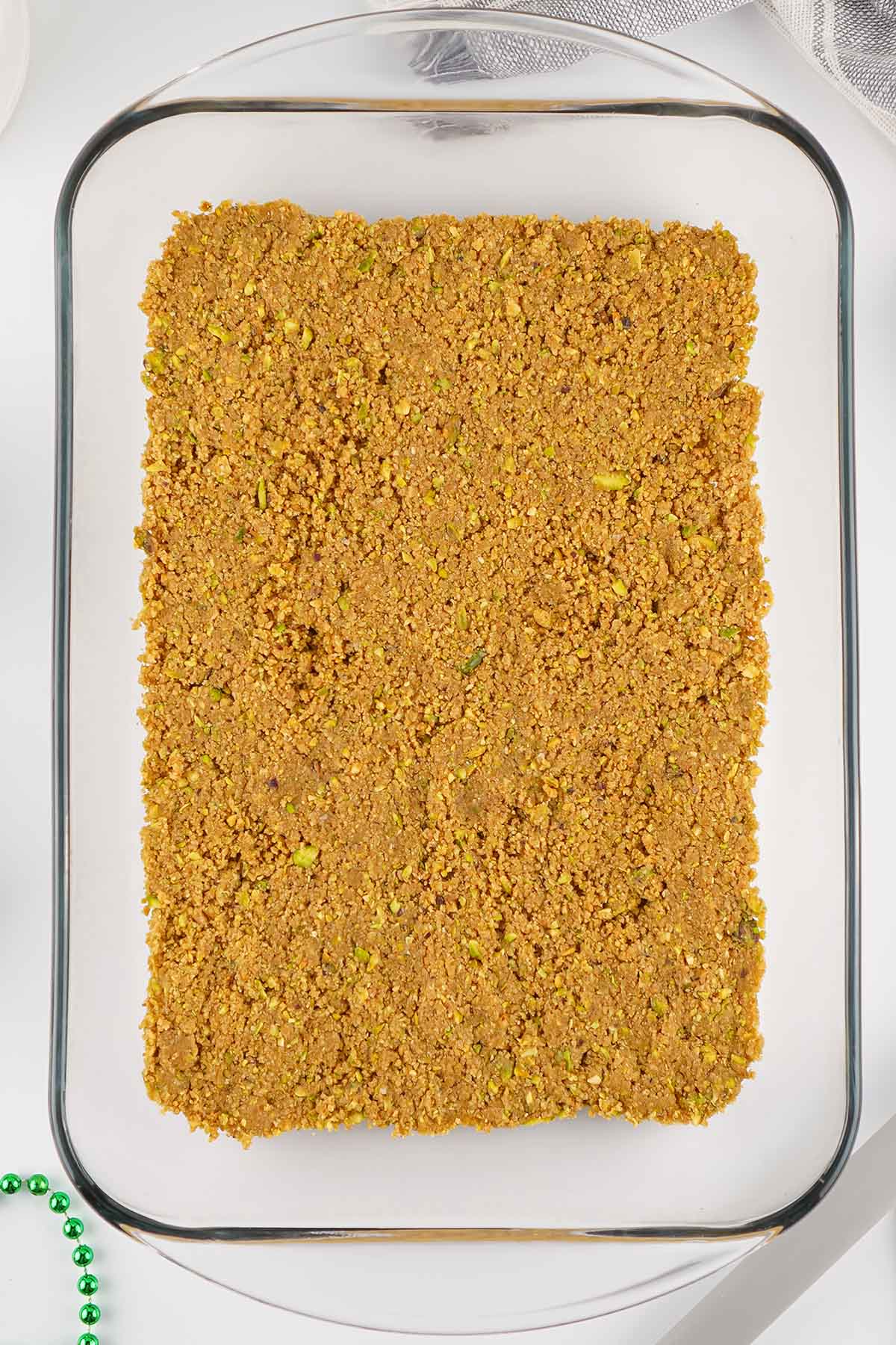 press graham cracker crumbs at the bottom of casserole dish. 