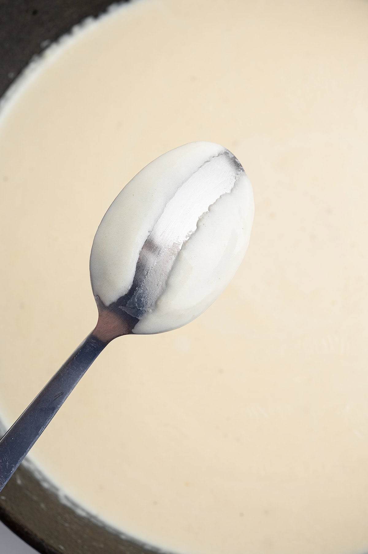 the sauce coats the spoon.