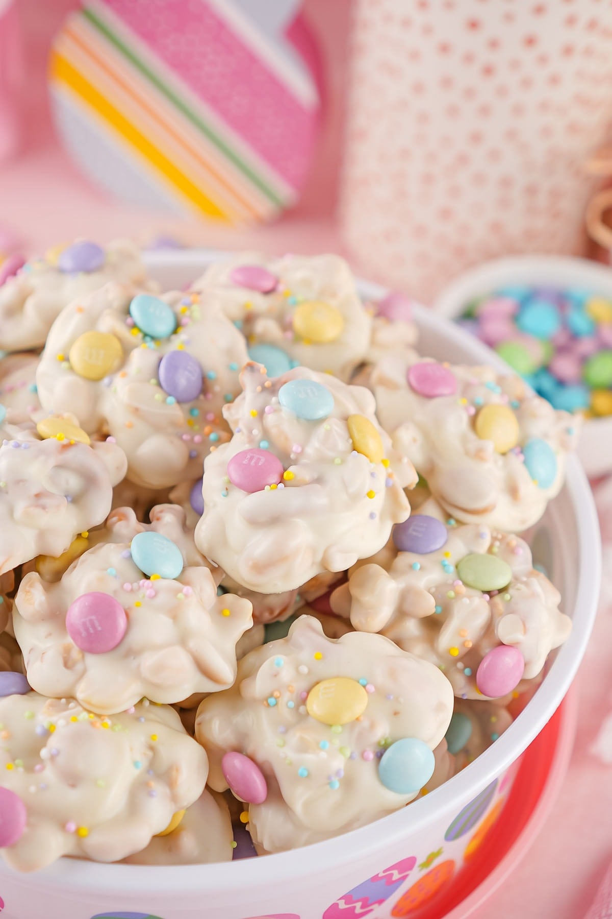 stacked crockpot candy inside white bowl. 