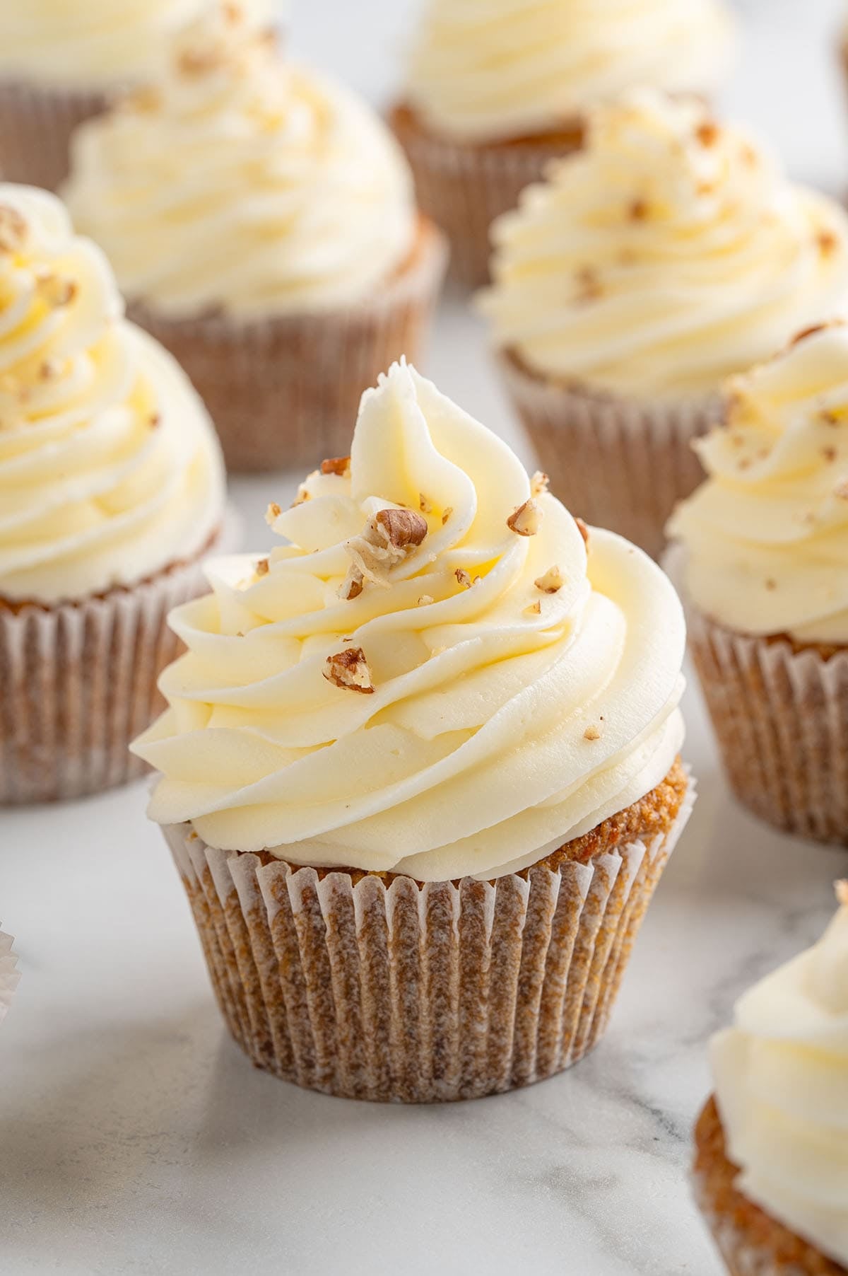 carrot cake cupcake with cream cheese frosting. 