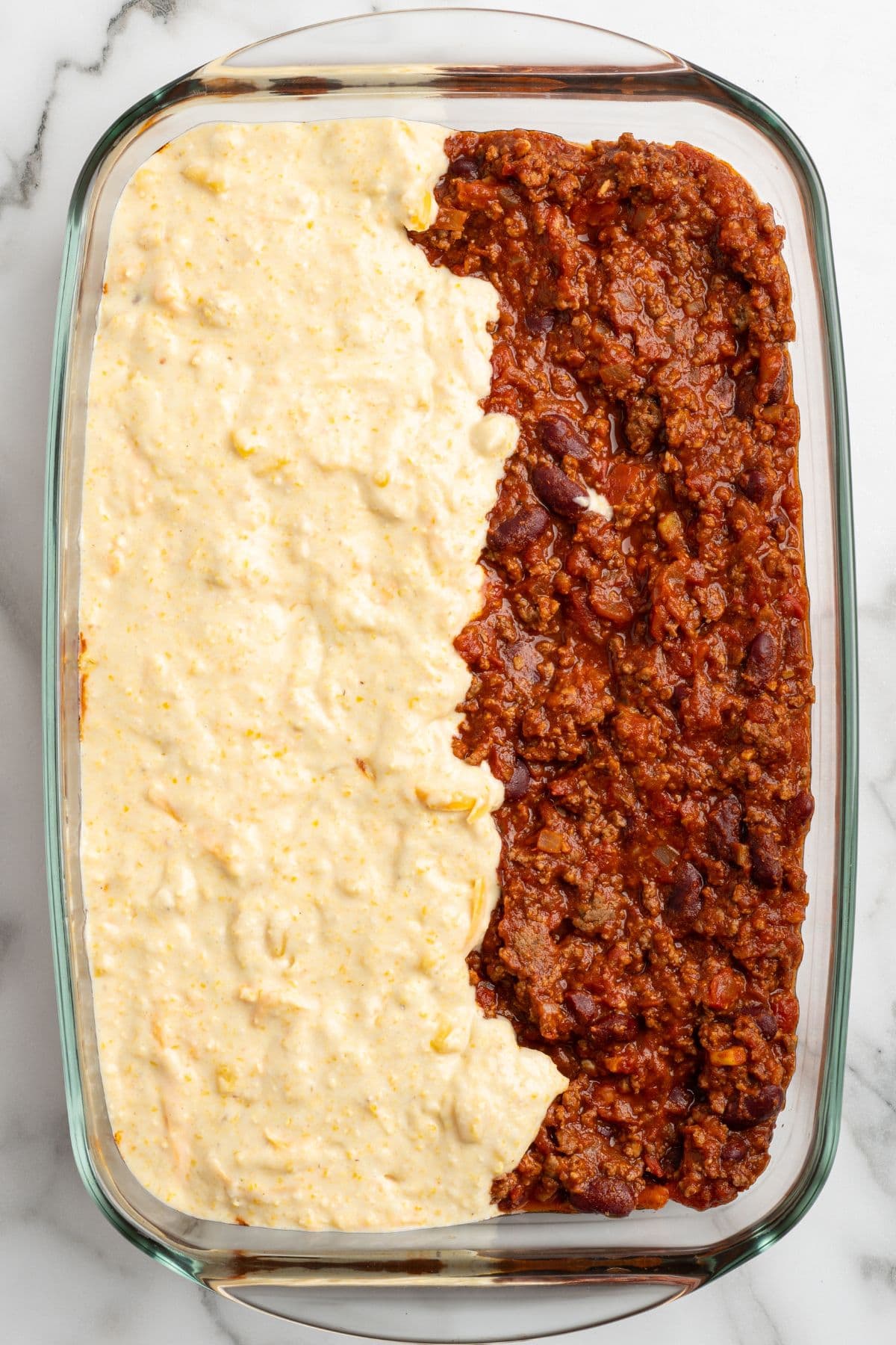 add the cornbread mixture on top of the chili.