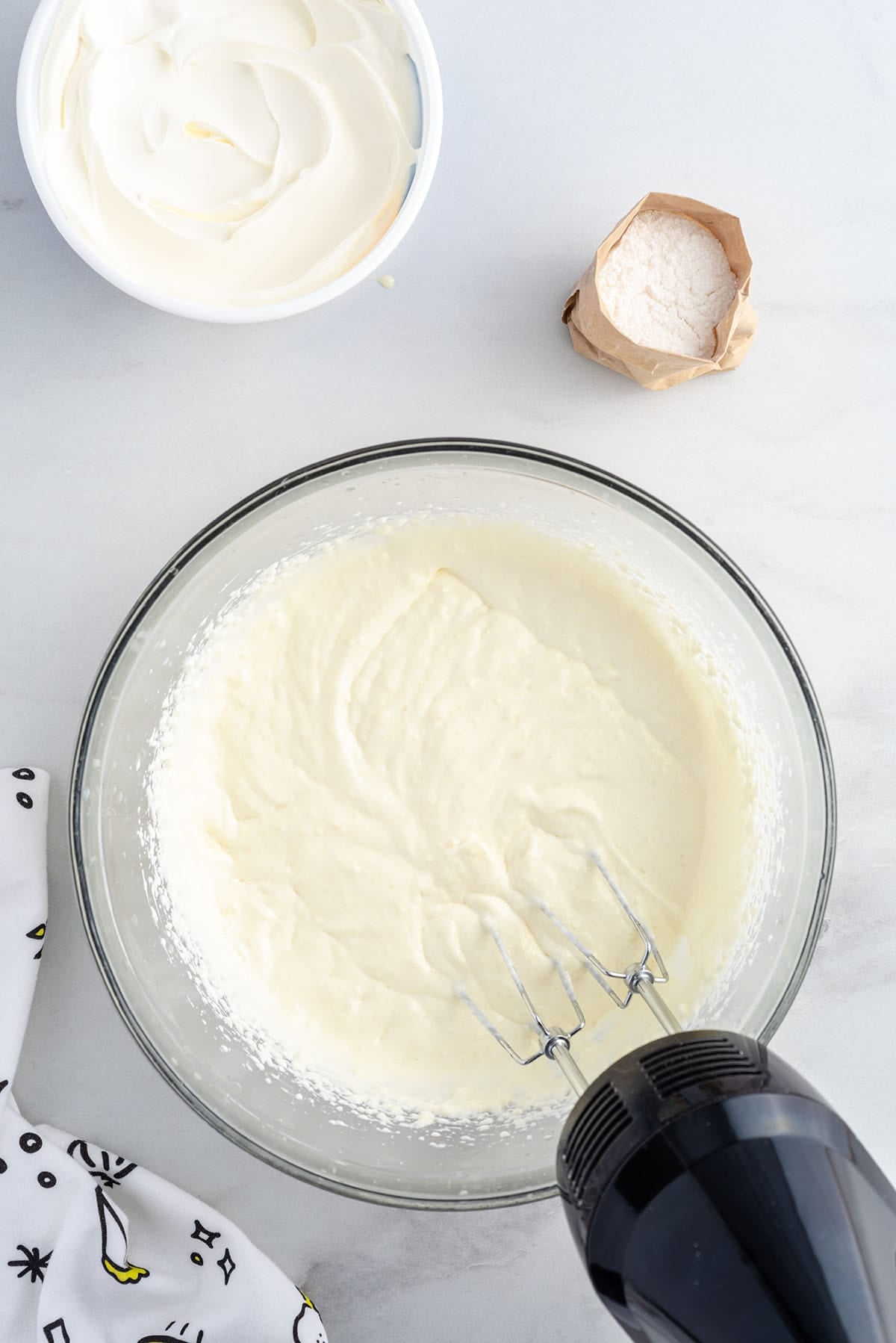  beat the cream cheese, sweetened condensed milk, thawed lemonade concentrate, and lemon extract.