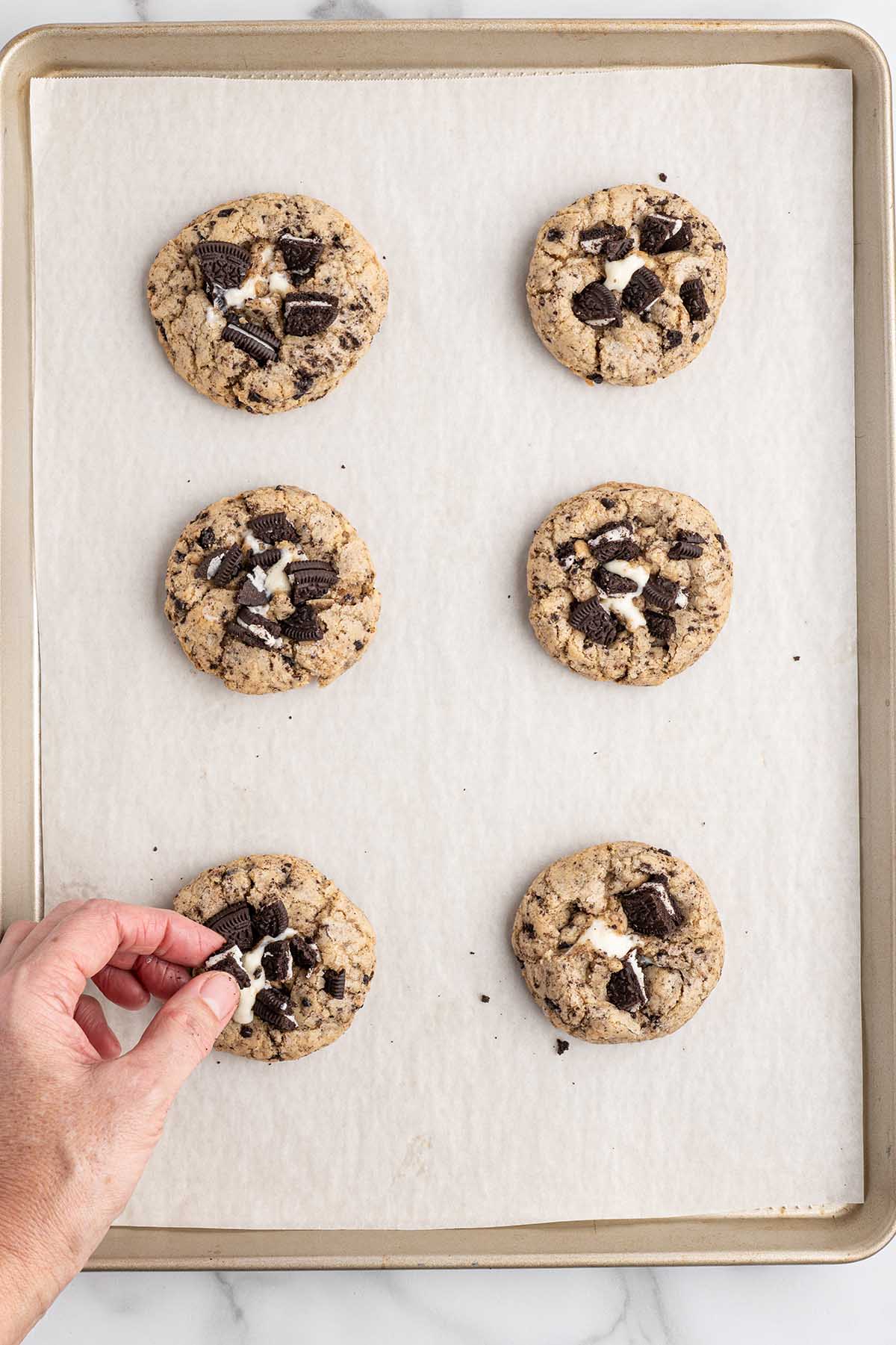 oreo cheesecake cookies on top of baking tray. 