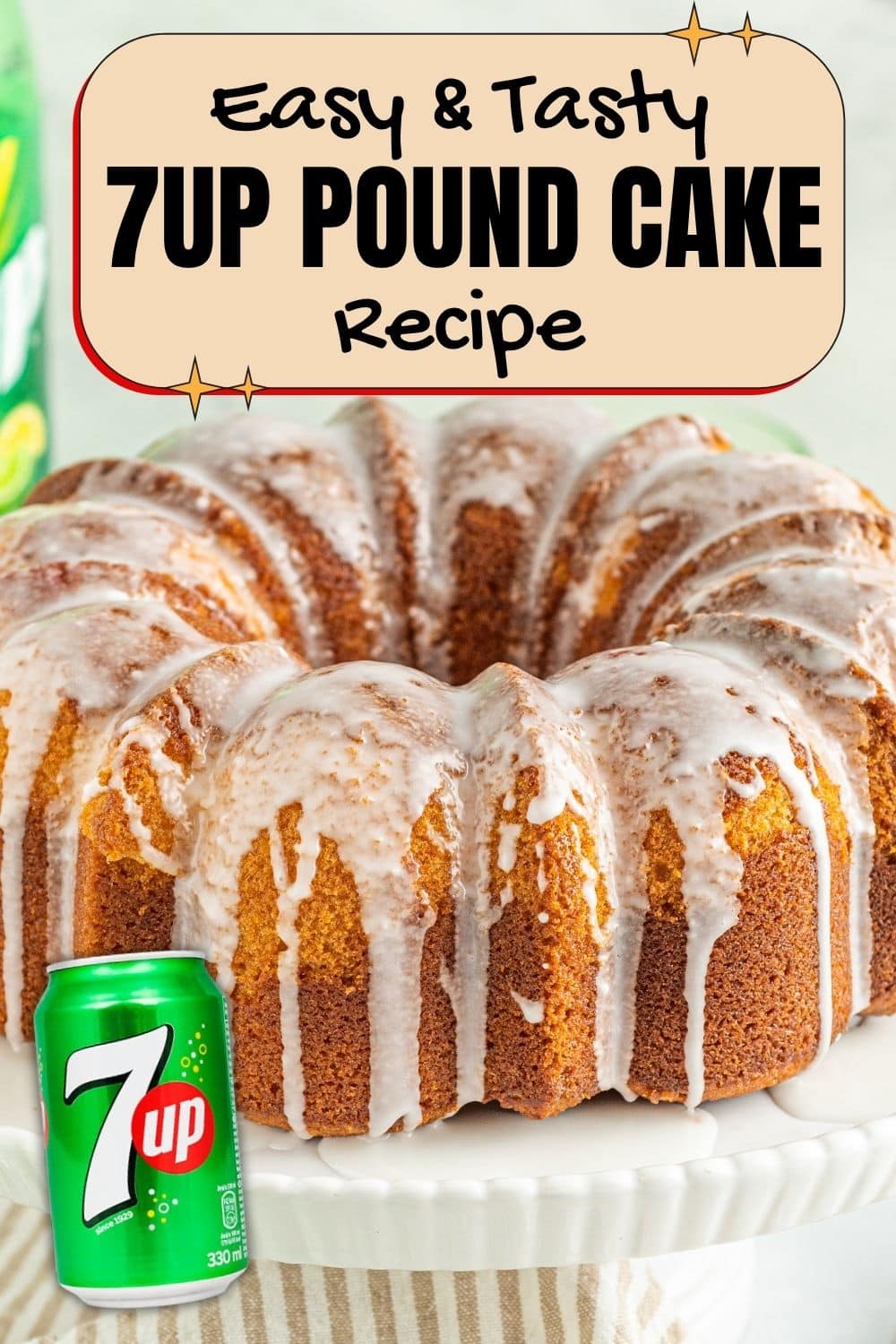 7UP pound cake with white glaze on a cake stand with a 7UP can in front.