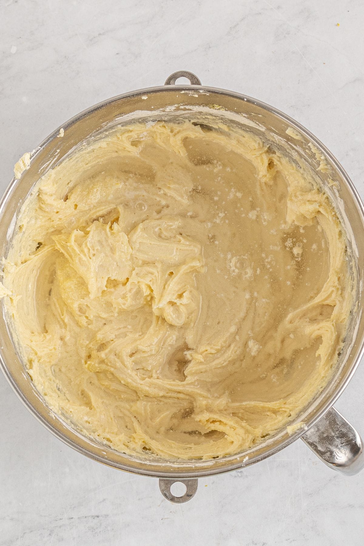 7UP pound cake batter with 7UP added in a stand mixer bowl.