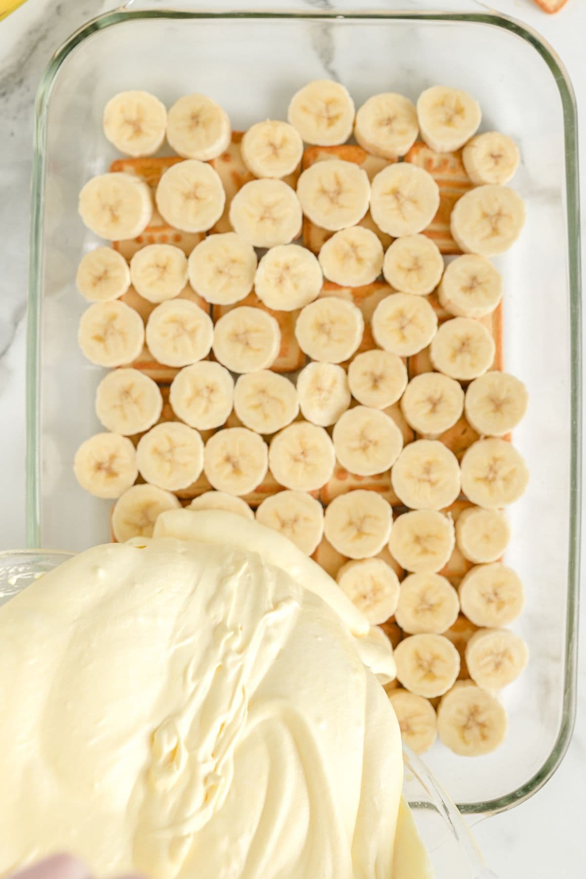 pour the pudding mixture on top of the bananas.