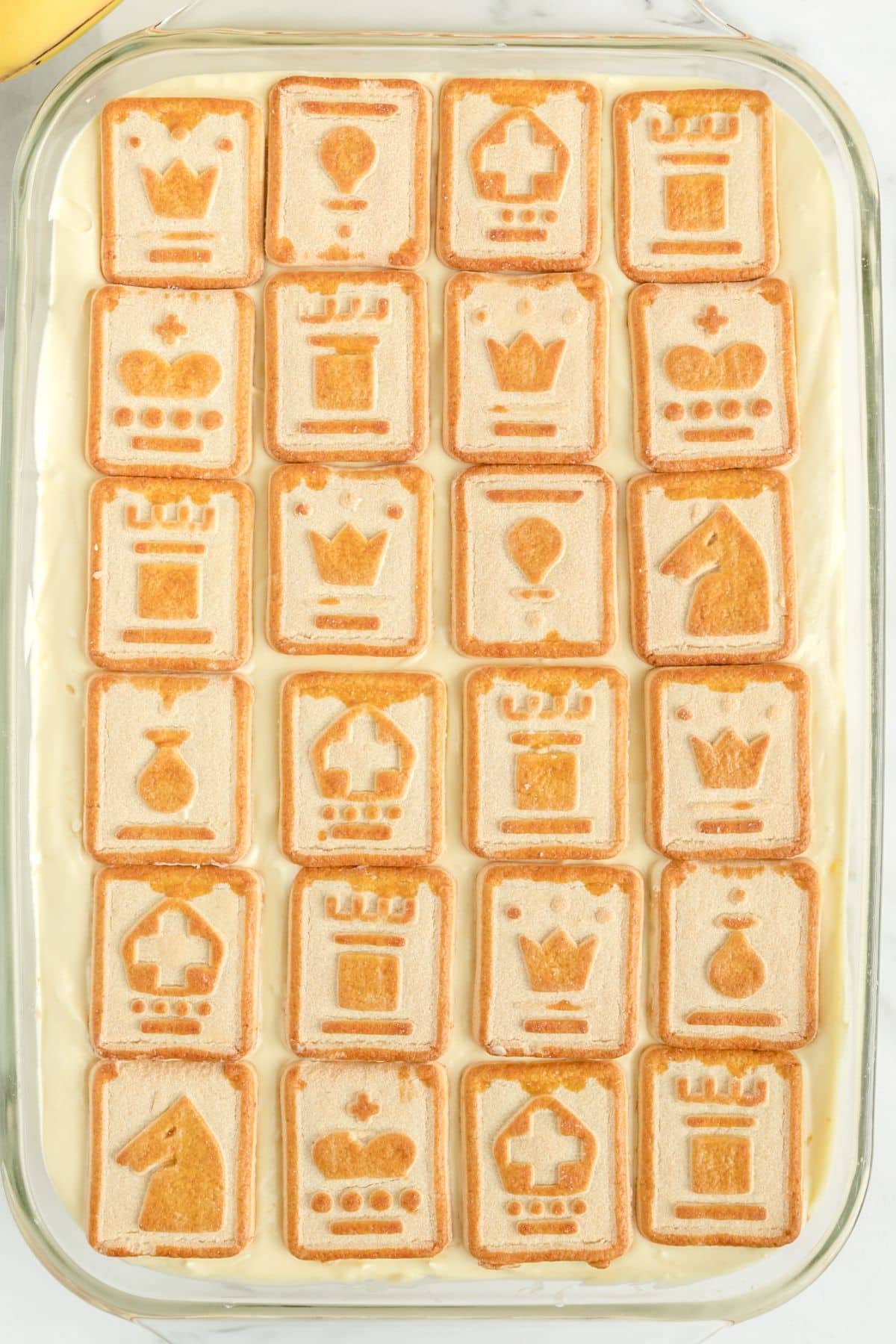 layer the cookies on top of the pudding mixture. 