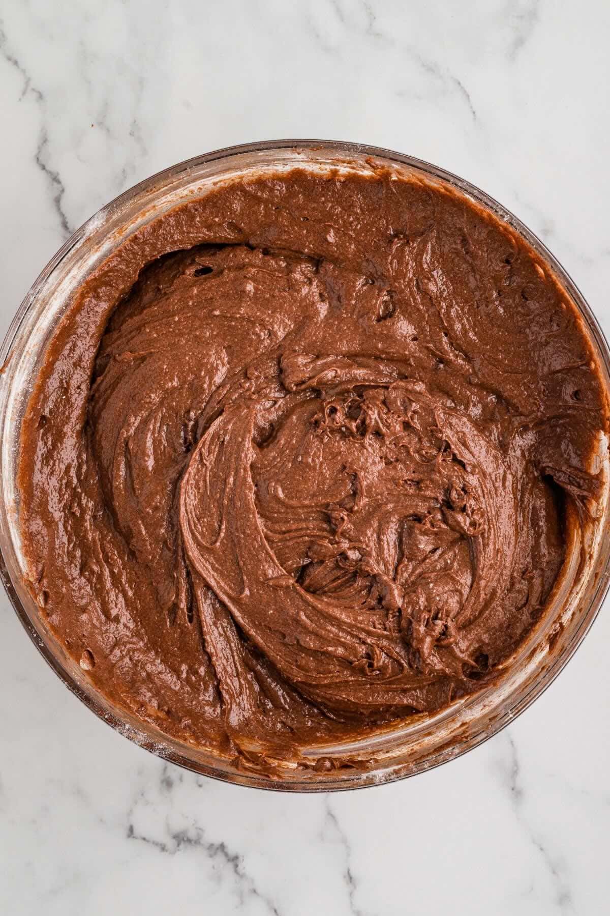 Smooth chocolate brownie batter in a mixing bowl.