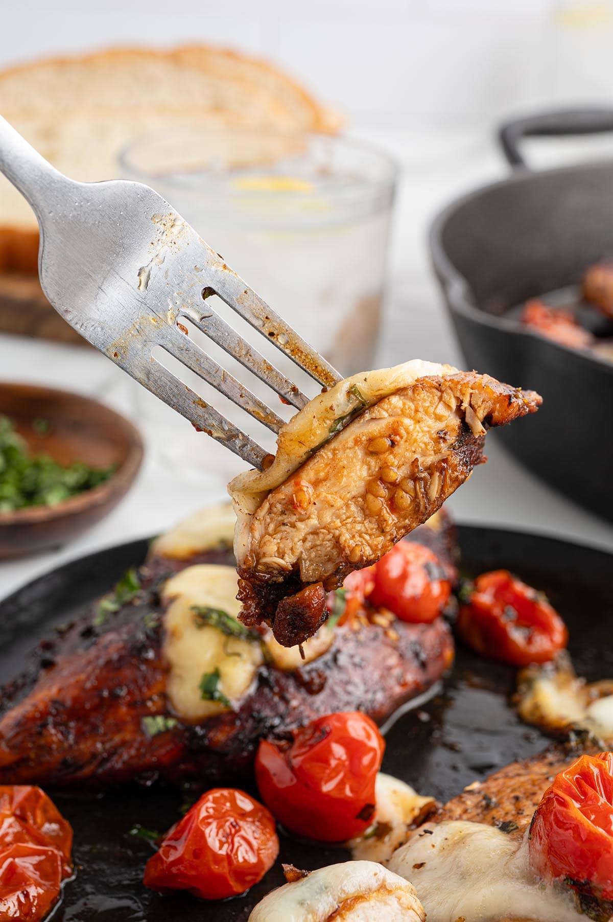 Slice chicken pick by a fork.