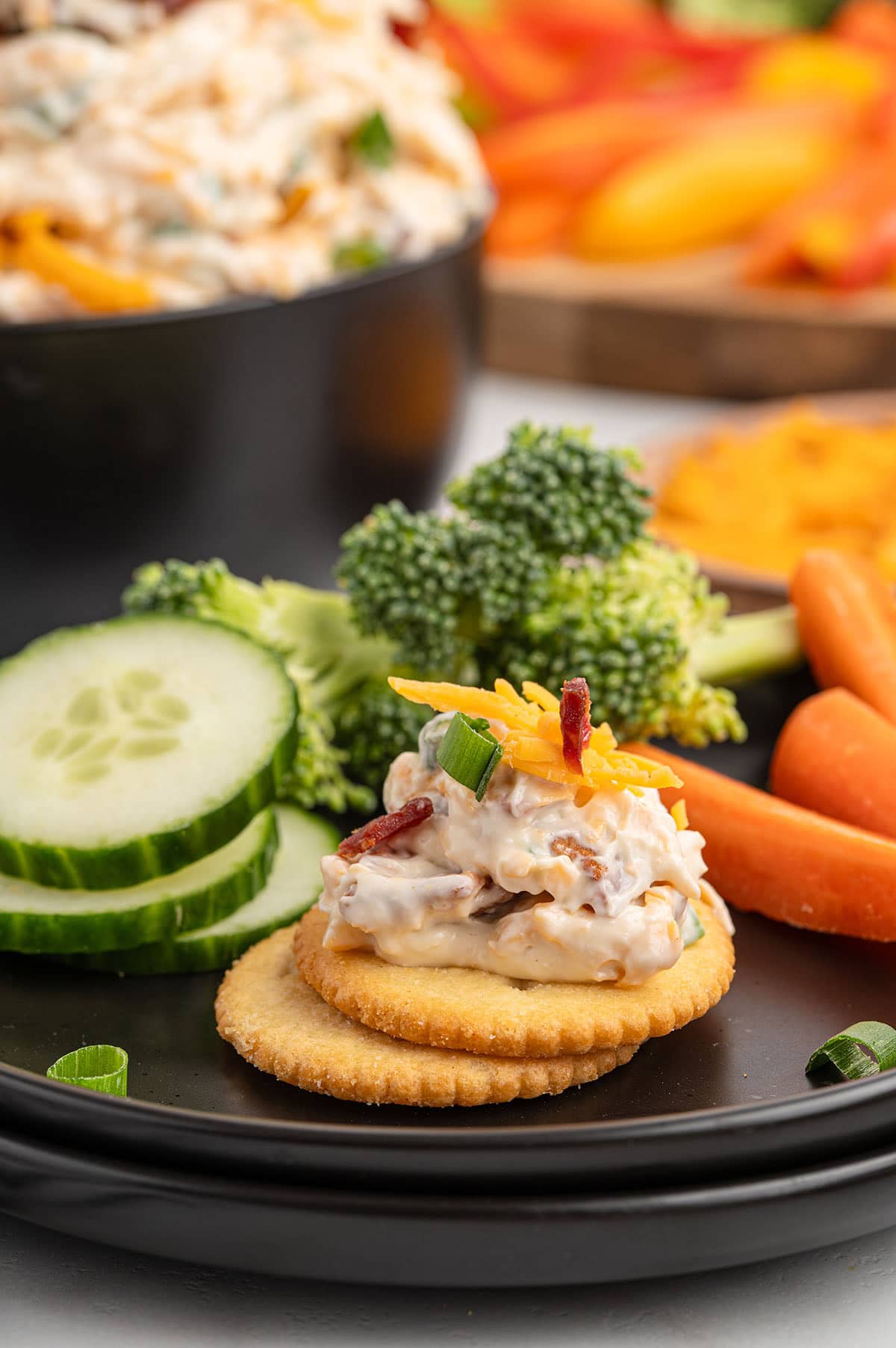 eating the dip with crackers.
