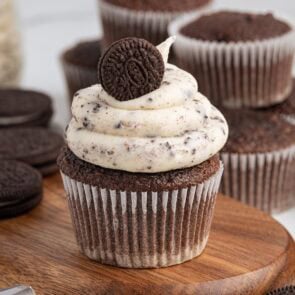 Chocolate cupcake with cookies and cream frosting topped with a mini Oreo.