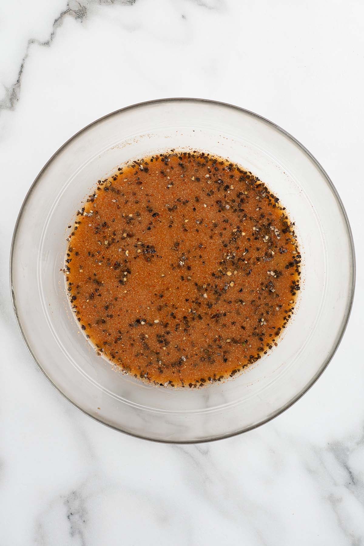 Black pepper sauce for Panda Express pepper chicken in a glass bowl.