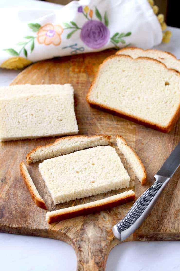 Cut a bread on cutting board.