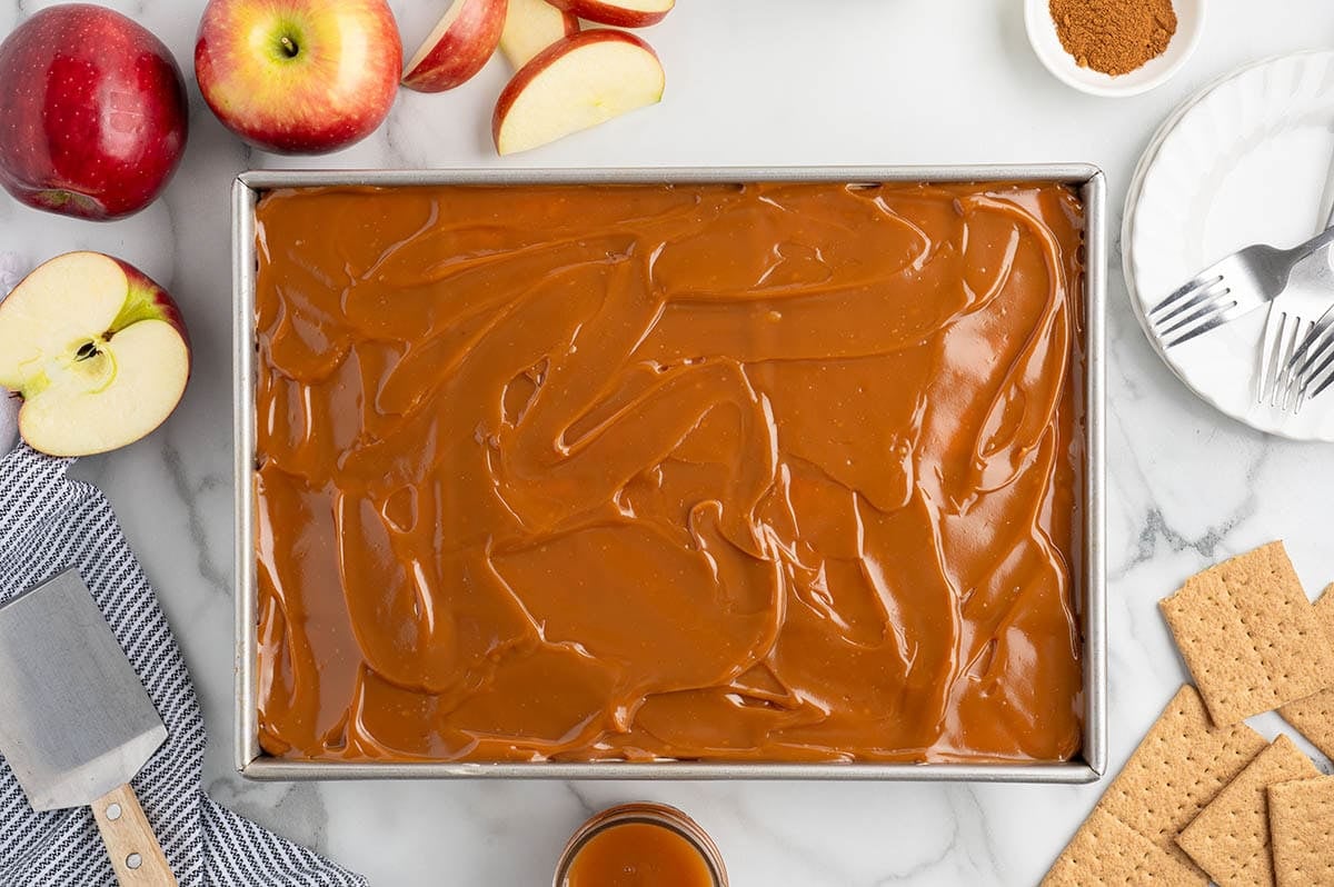 Spread the caramel evenly over the top, then chill until set before serving.