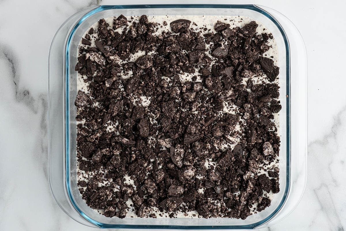 Frozen Oreo dessert topped with crushed Oreo cookies.