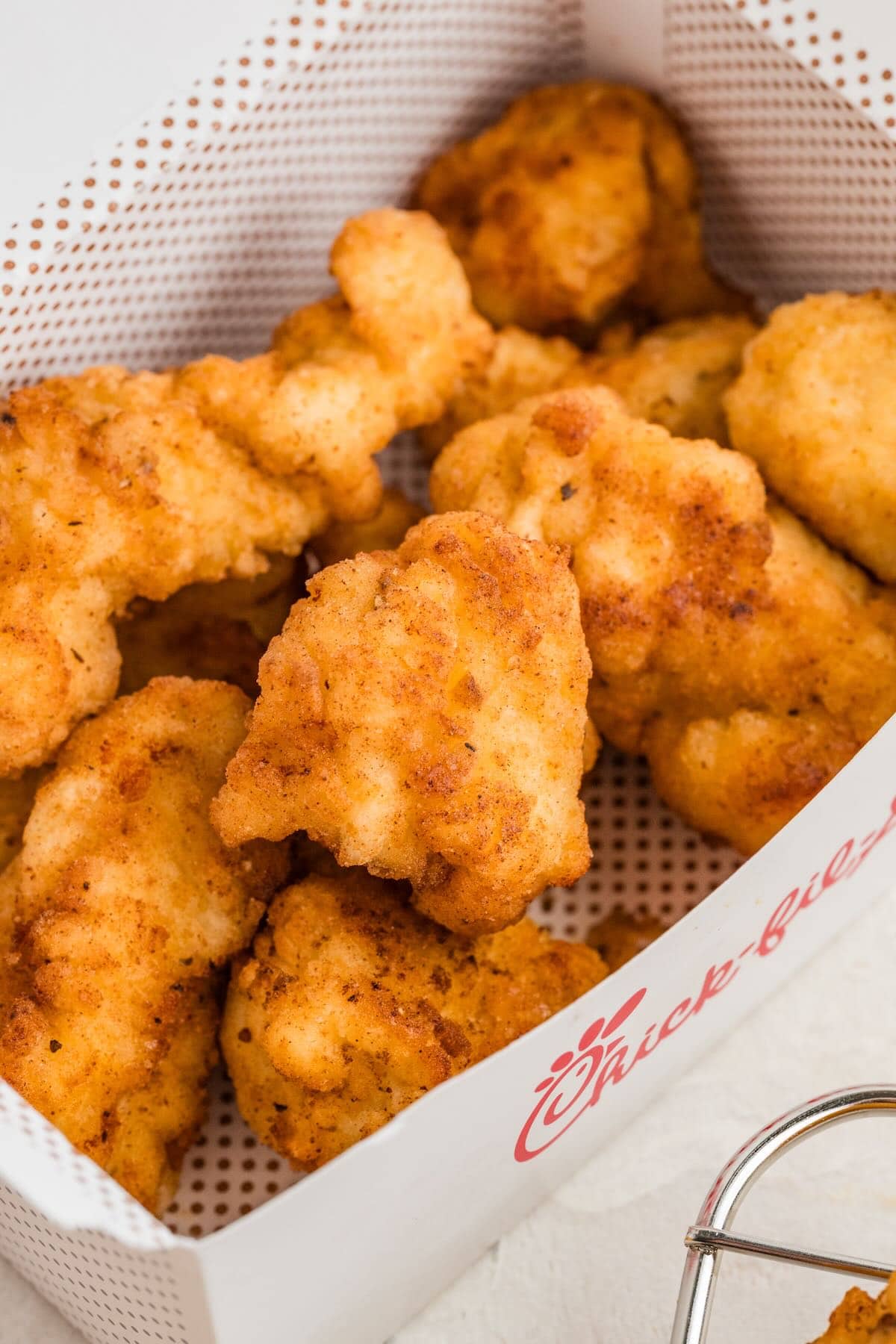 chick fil a nuggets inside chick fil a box. 