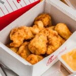 chick fil a nuggets placed inside chick fil a takeaway box.