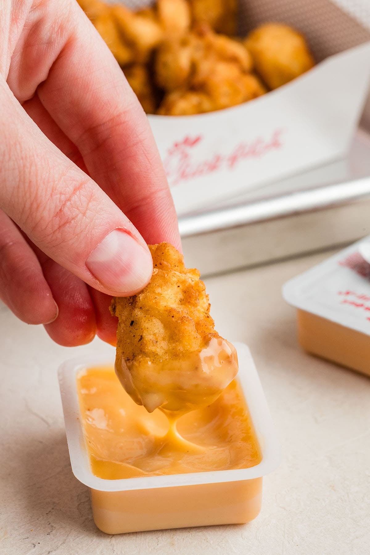 Serve the nuggets warm with your favorite dipping sauce. 🍗🧀