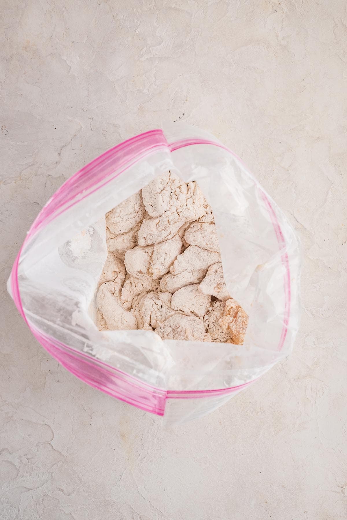 Coat the marinated chicken in the seasoned flour mixture, shaking off any excess.