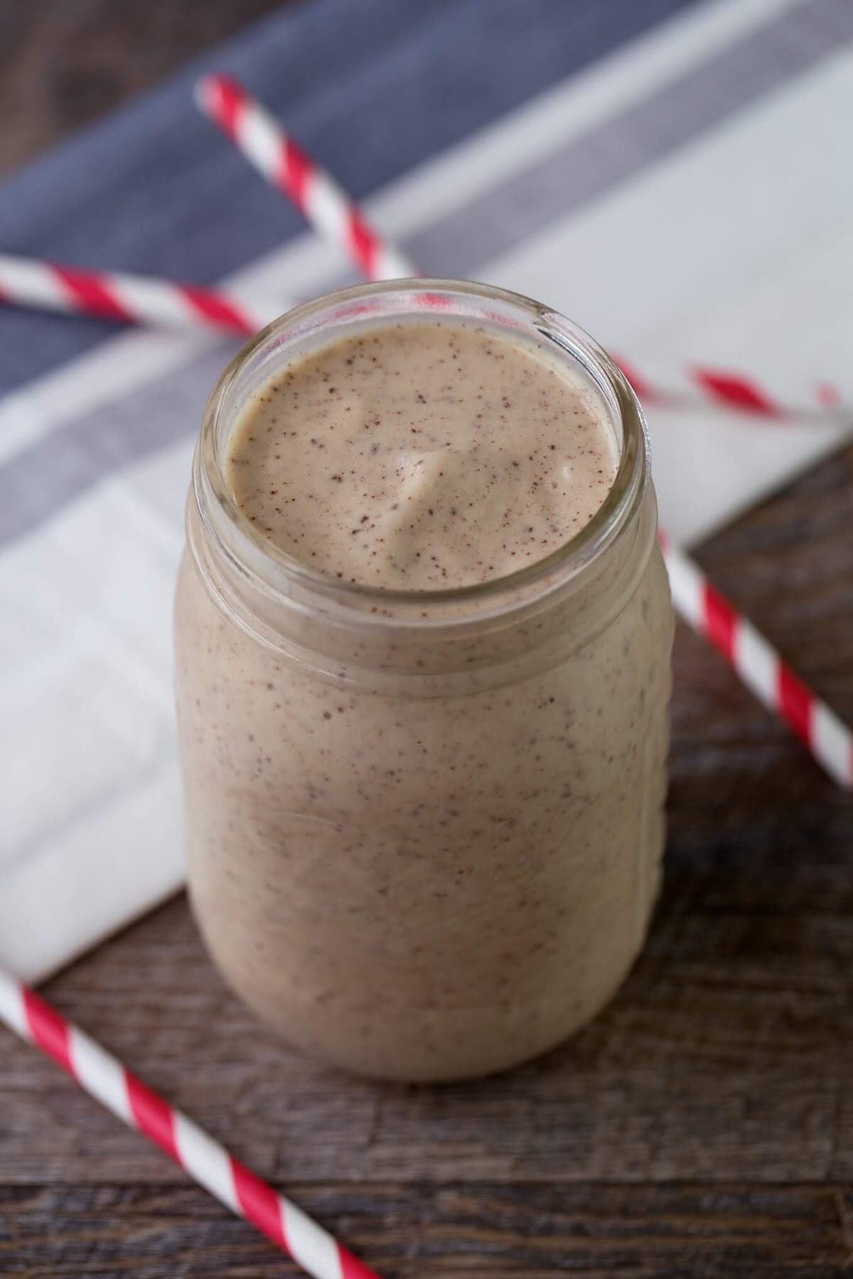 a mason jar full of chunky monkey smoothie.