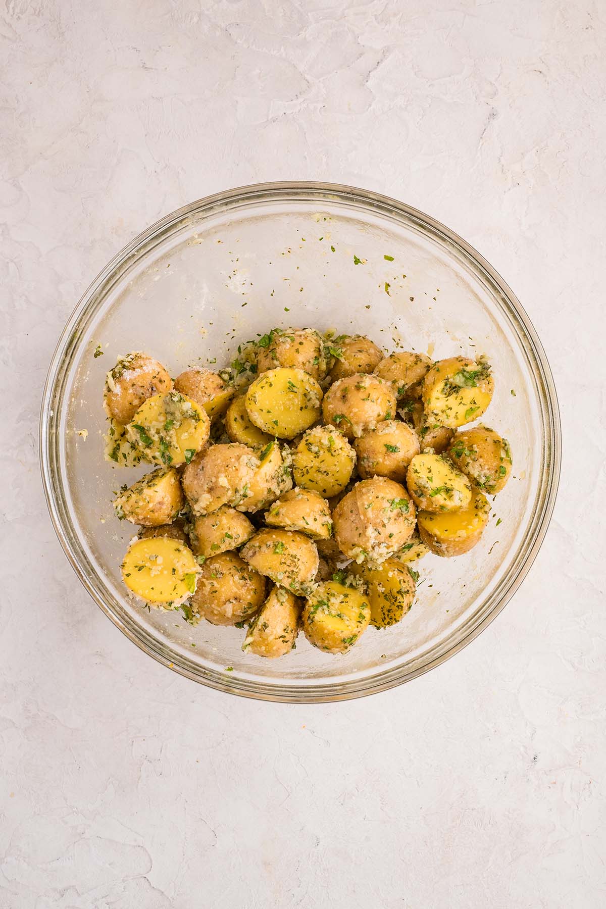 Baby potatoes tossed in ranch seasoning and herbs, ready to roast.