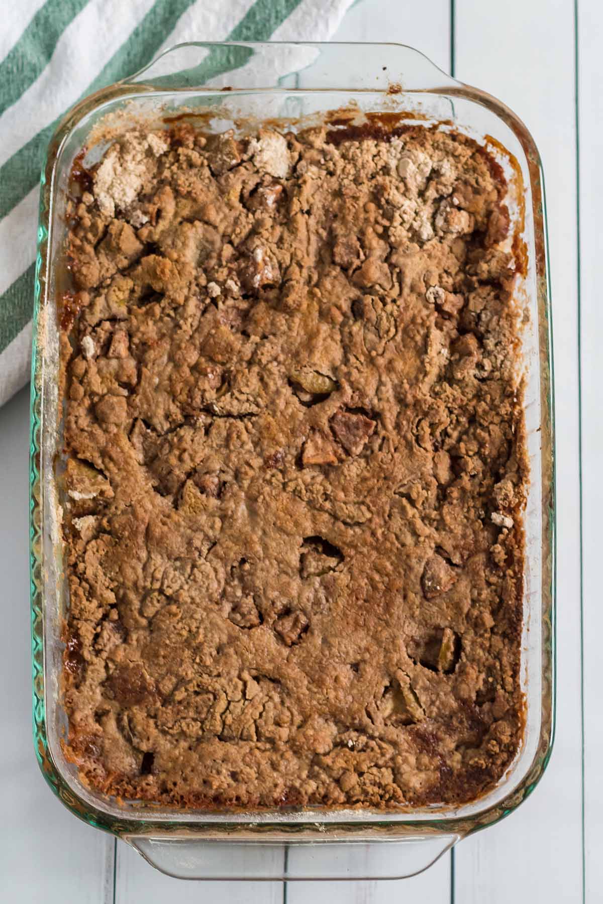Freshly baked apple dump cake in a glass baking dish.