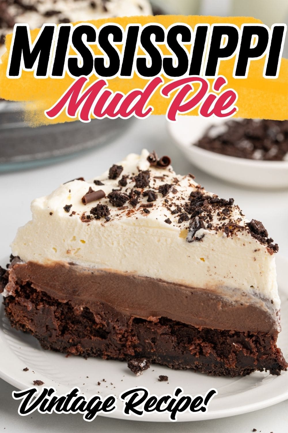 Slice of Mississippi mud pie with layered chocolate and whipped cream on a plate.