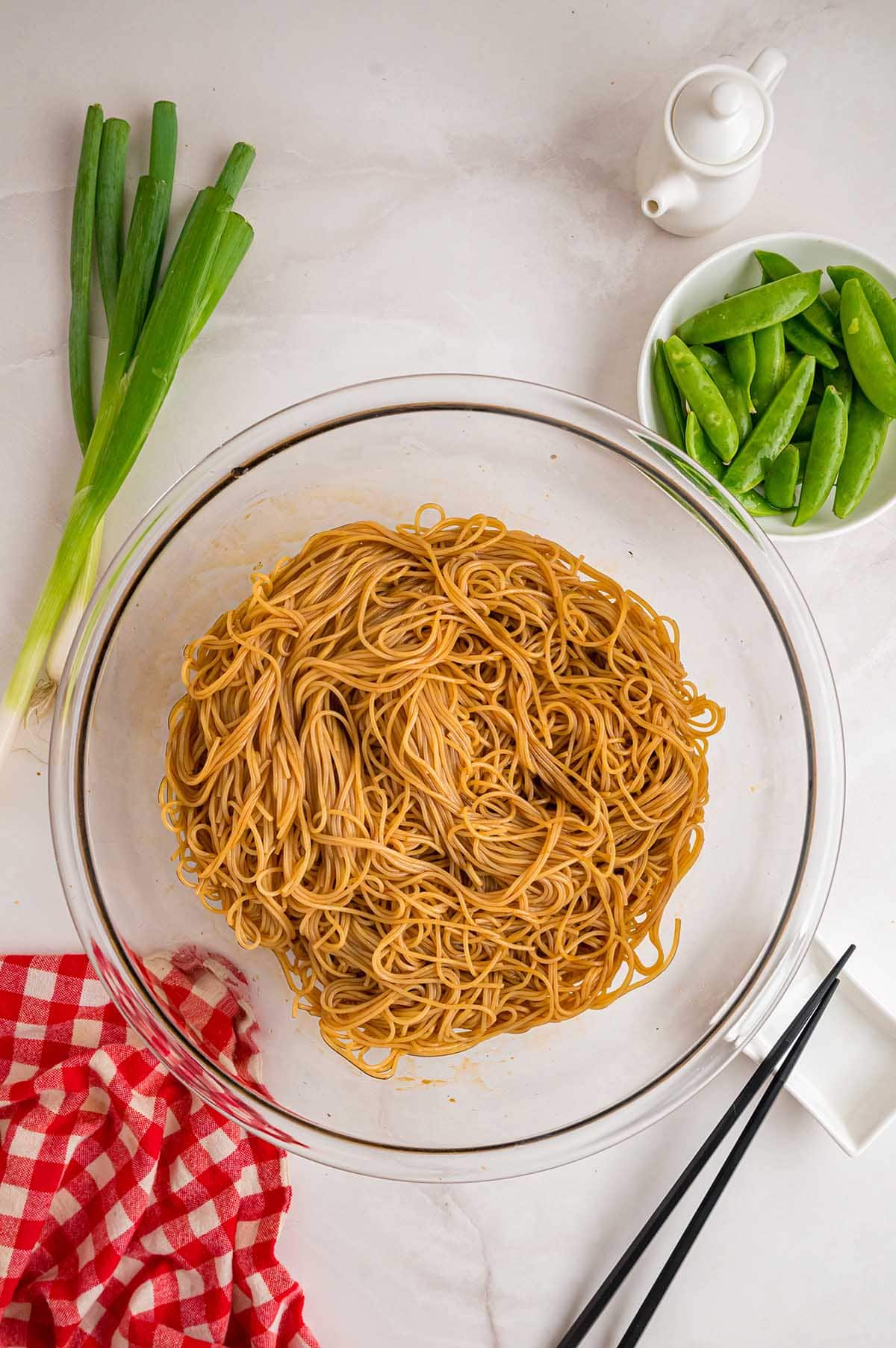 Cooked noodles in a bowl ready for Asian noodle salad.