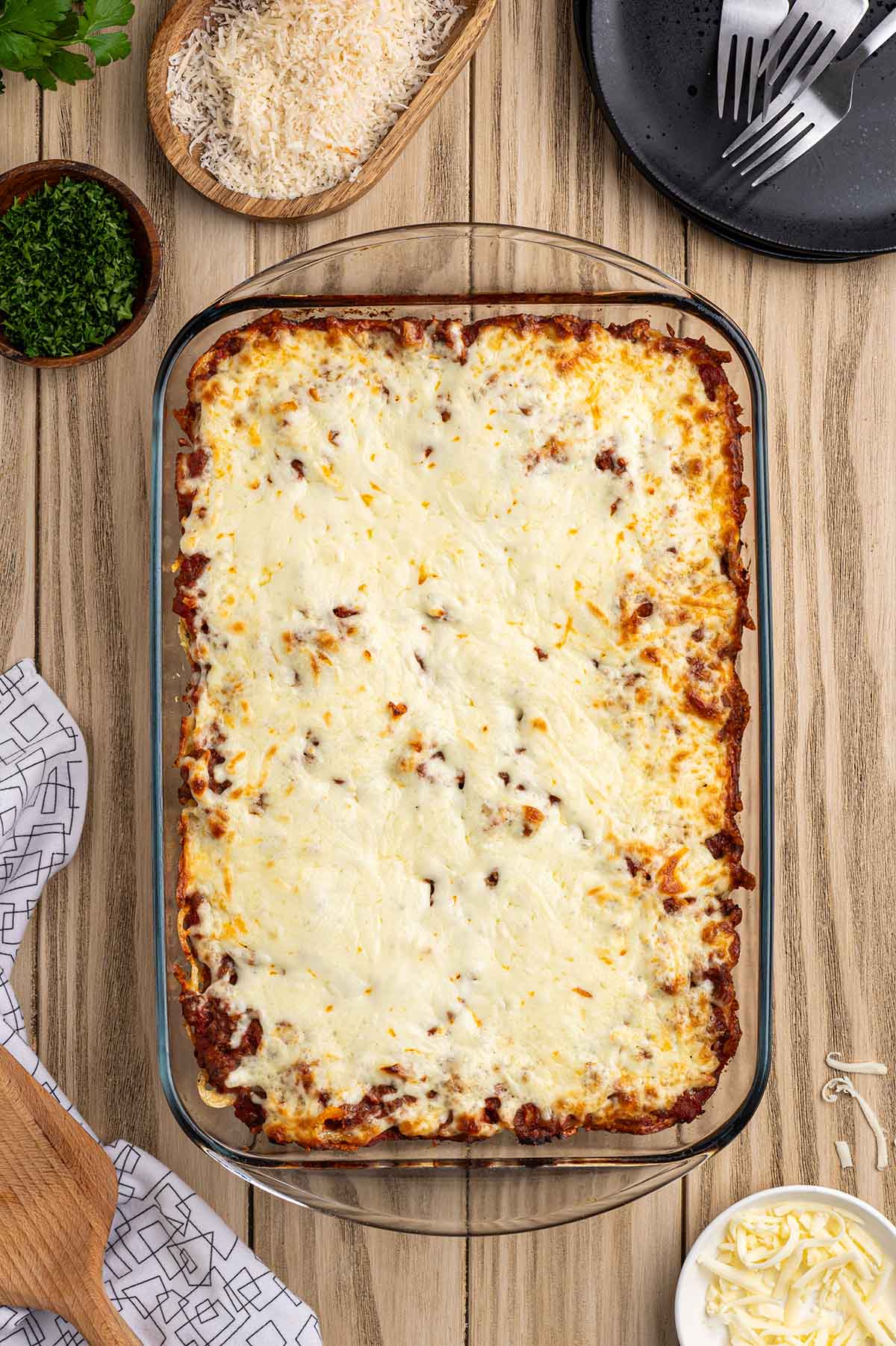 Baked spaghetti with a golden, bubbly melted mozzarella topping.