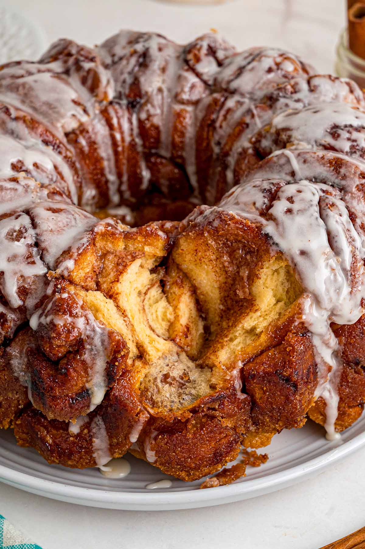 Cinnamon roll monkey bread with a soft, fluffy center and sweet glaze.