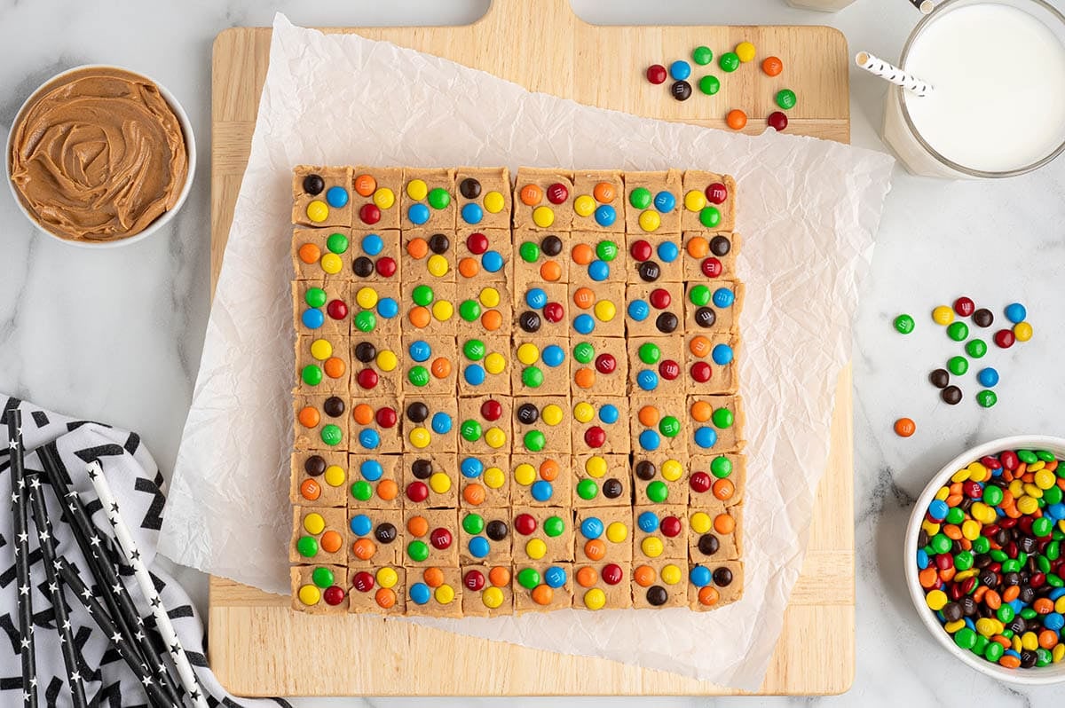 Cut peanut butter fudge squares topped with colorful M&M's candies.
