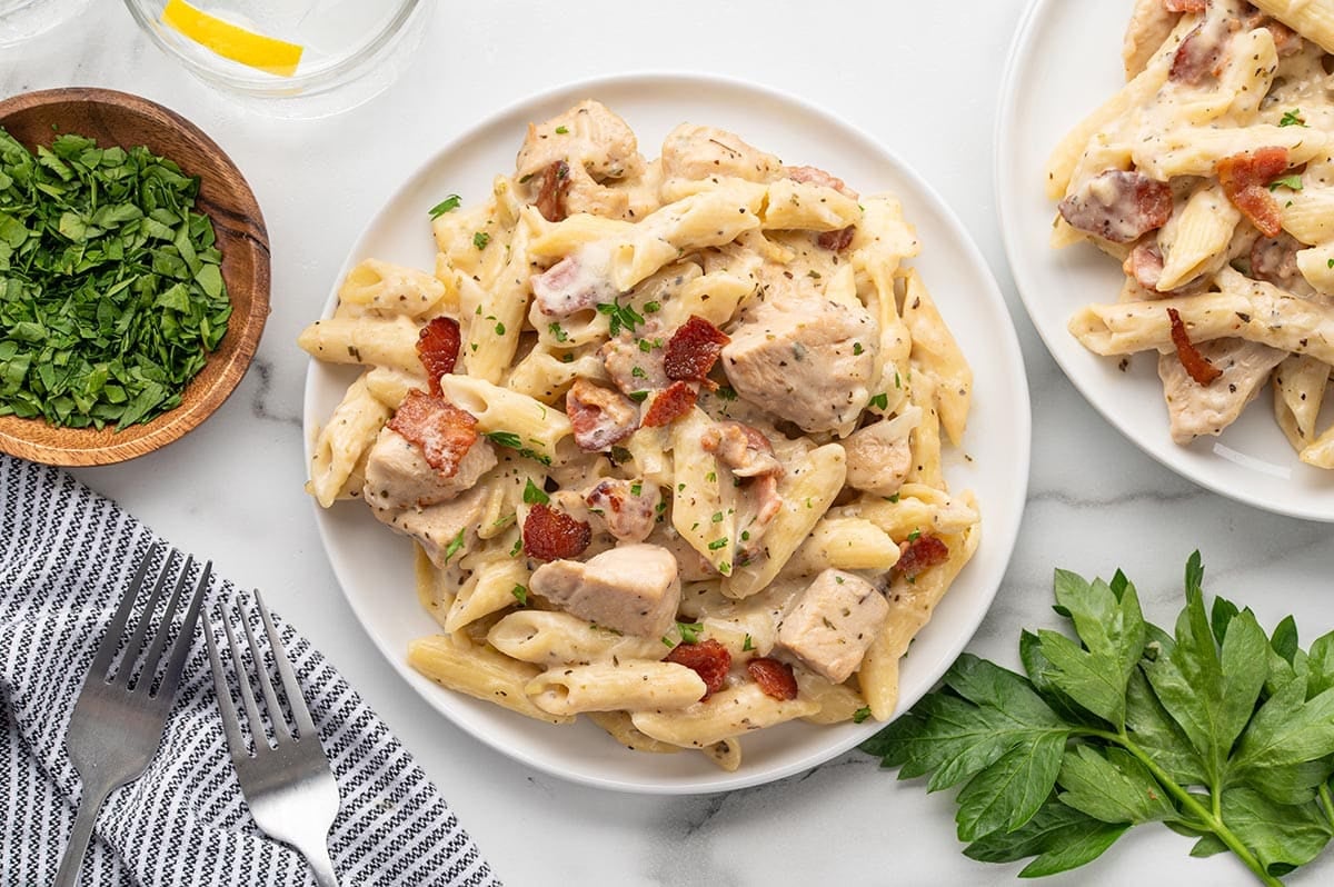Serve this creamy Chicken Bacon Ranch Casserole warm, topped with crispy bacon and fresh parsley for an easy, hearty dinner.