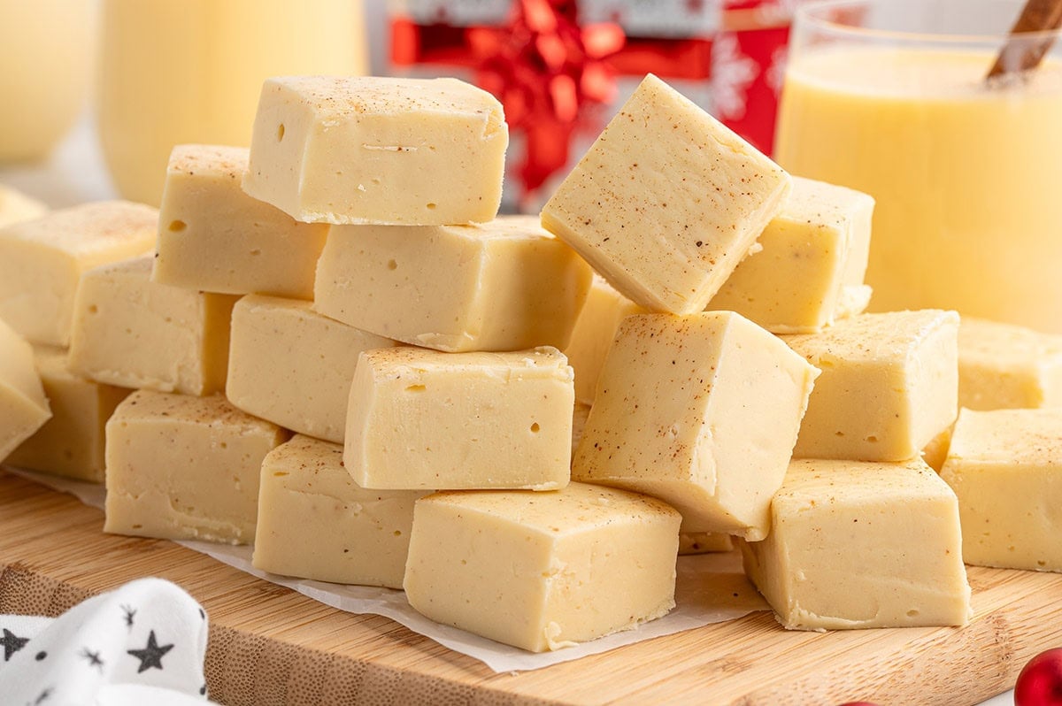 Eggnog fudge squares with a creamy texture and a light sprinkle of nutmeg.