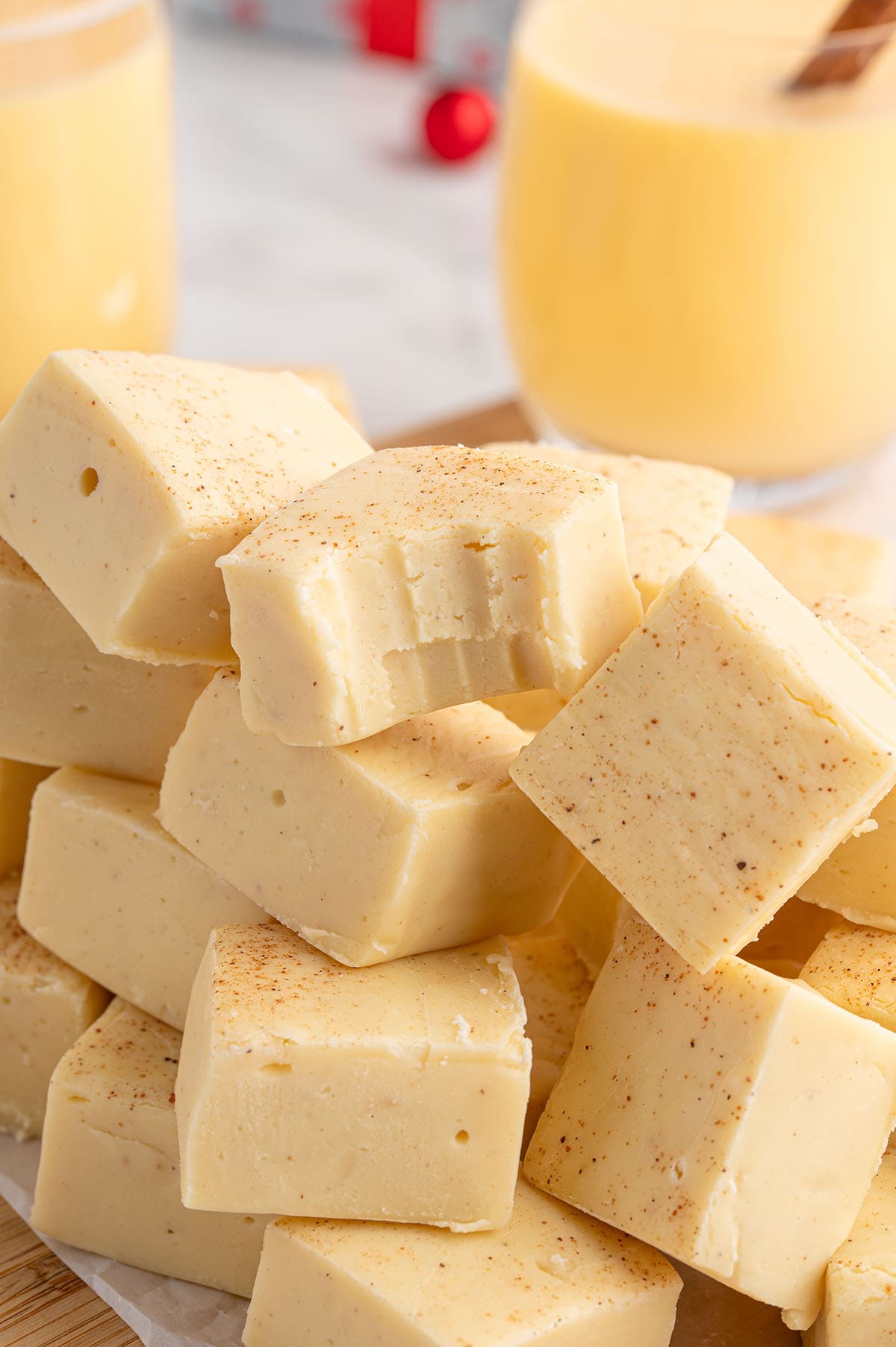 Eggnog fudge squares with a creamy texture, lightly sprinkled with nutmeg.