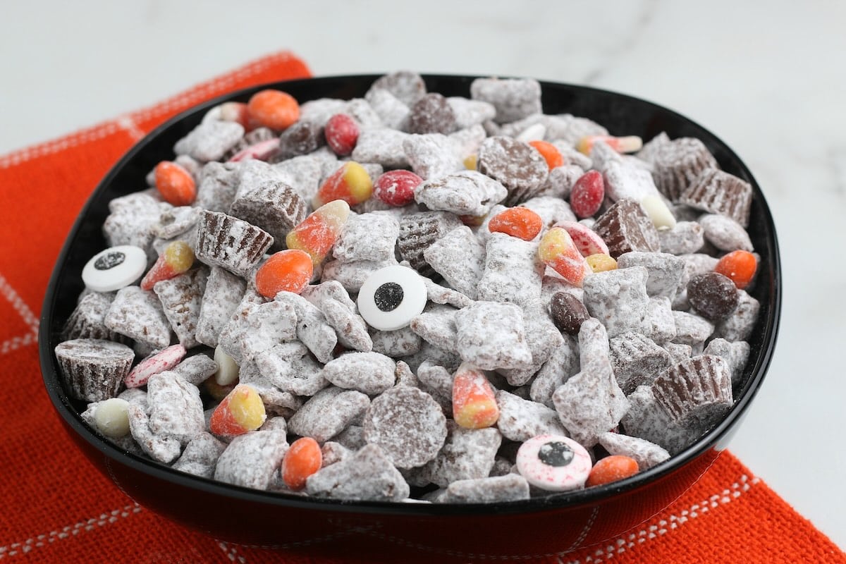 halloween puppy chow in a black bowl.