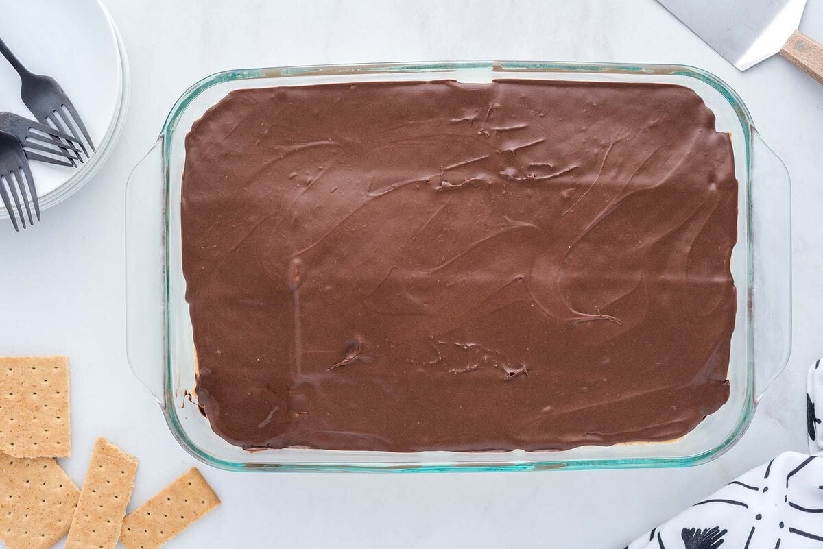 eclair cake with chocolate ganache layer on top.