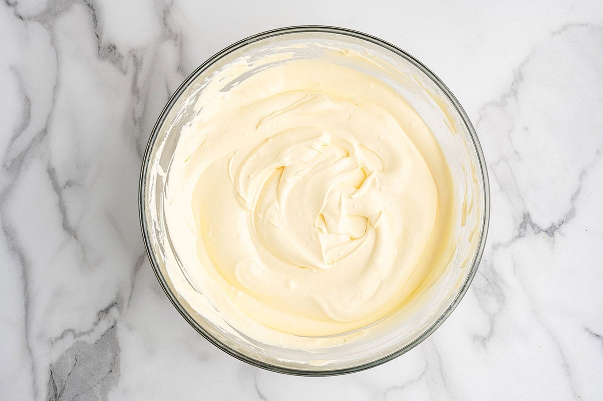 Bowl of smooth, creamy vanilla pudding mixture for eclair cake.