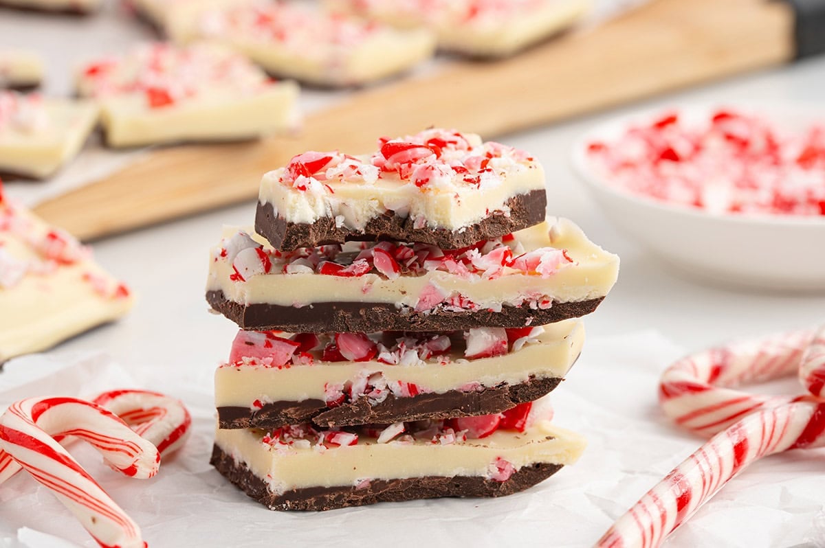Peppermint bark stacked with candy canes.