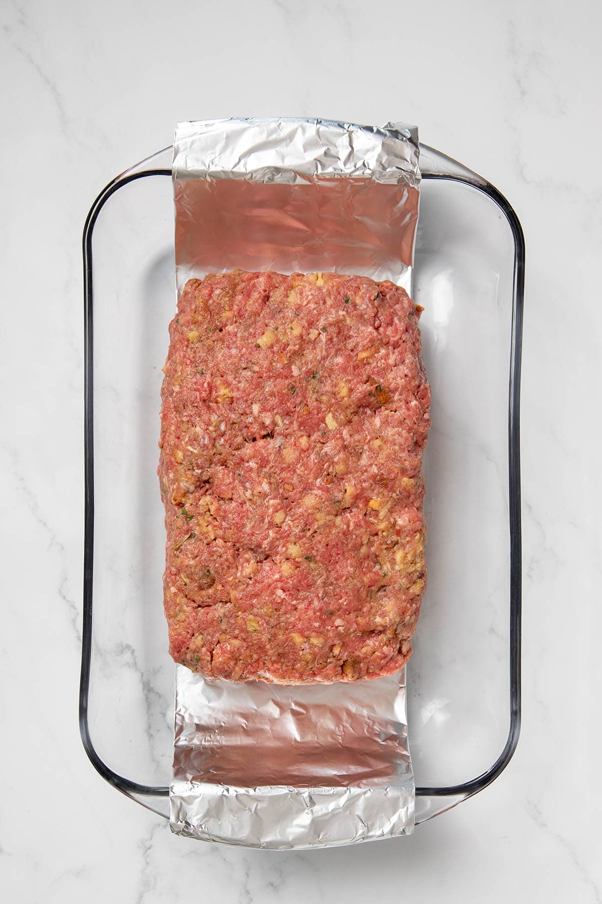 Stove Top stuffing meatloaf shaped in a baking dish.