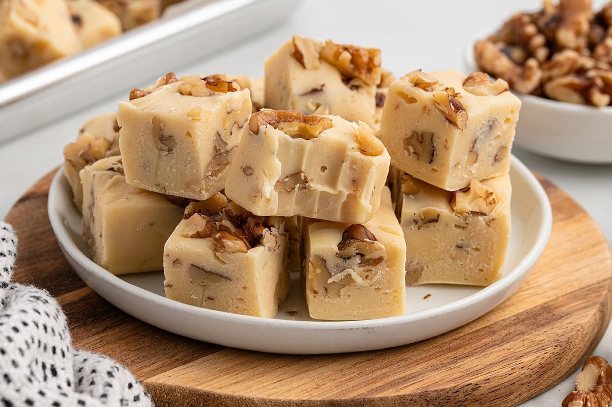 Creamy maple walnut fudge topped with chopped walnuts.
